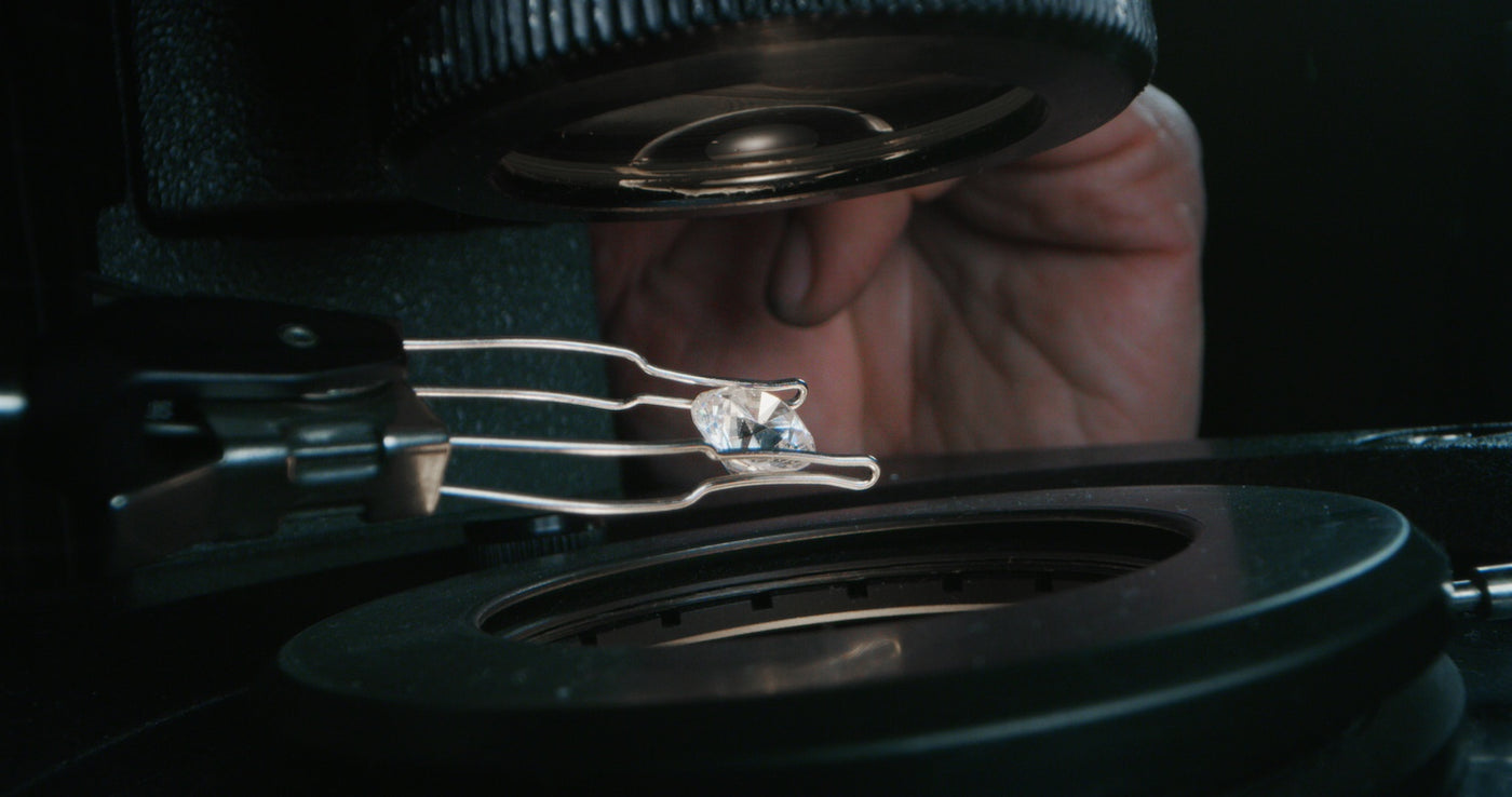 Diamond being examined to determine if it's mined or lab grown.